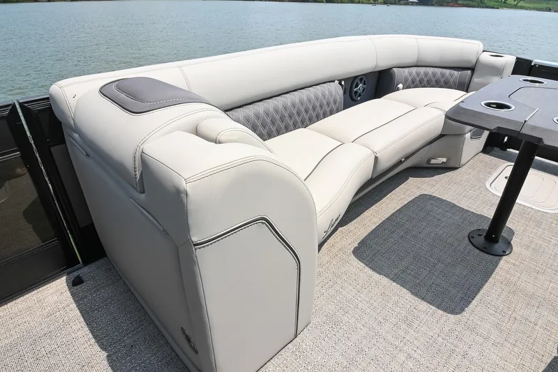 Slide: The Image of Luxurious seating on 2025 Barletta Lusso 25UCA pontoon boat with lake view. - 41