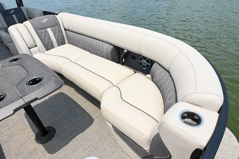 Slide: The Image of Luxurious seating on 2025 Barletta Lusso 25UCA pontoon boat, featuring elegant upholstery and cup holders. - 15
