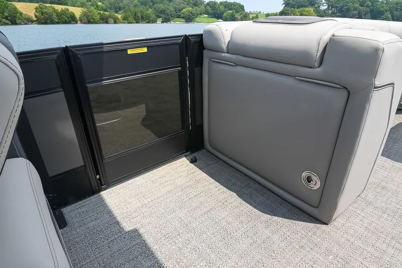 Slide: The Image of 2025 Barletta Lusso 25UCA pontoon boat interior with sleek seating and lake view. - 40