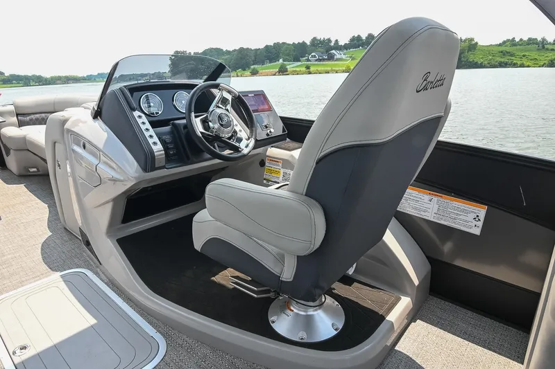 Slide: The Image of 2025 Barletta Lusso 25UCA boat interior with sleek helm and luxurious captain's chair. - 22