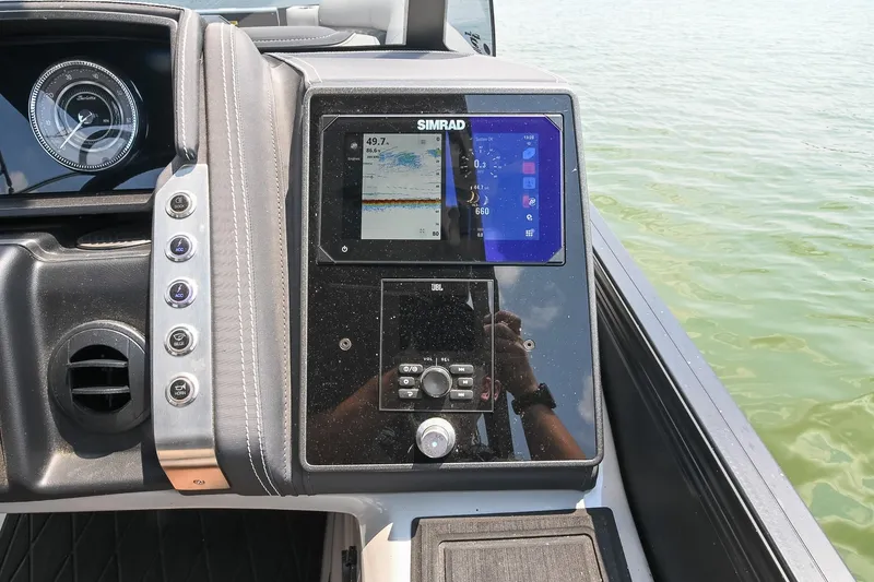 Slide: The Image of Dashboard of 2025 Barletta Lusso 25UCA with Simrad display on water. - 29