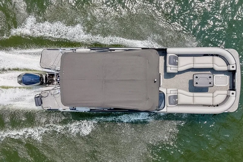 Slide: The Image of Aerial view of 2025 Barletta Lusso 25UCA pontoon boat cruising on water. - 5