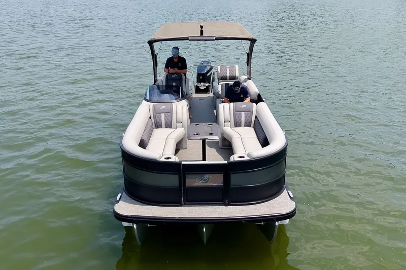 Slide: The Image of 2025 Barletta Lusso 25UCA pontoon boat cruising on a serene lake. - 51
