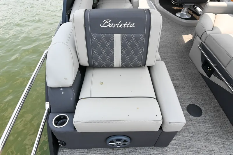 Slide: The Image of 2025 Barletta Lusso 25UCA boat seat with elegant stitching and cup holder. - 39