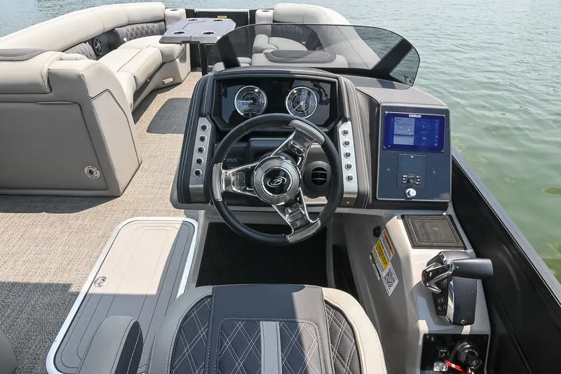 Slide: The Image of 2025 Barletta Lusso 25UCA boat interior with modern dashboard and luxurious seating. - 23