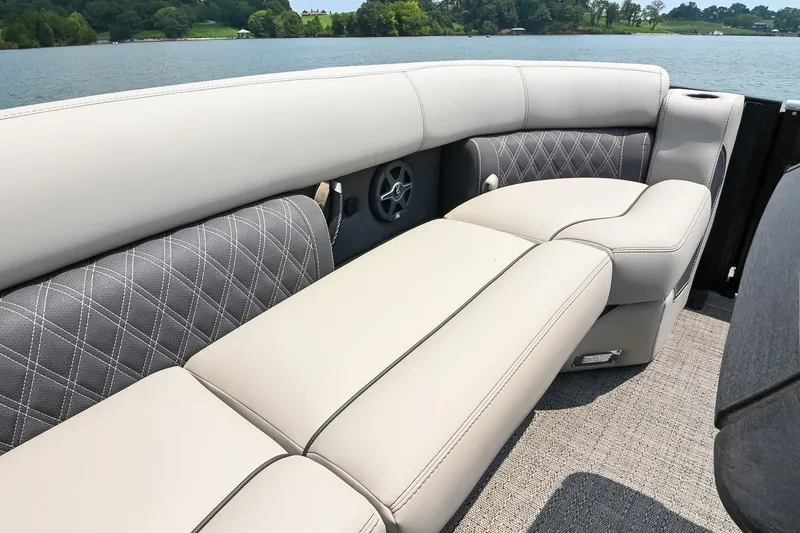 Slide: The Image of Luxurious seating on 2025 Barletta Lusso 25UCA pontoon boat, featuring elegant upholstery and scenic lake view. - 44