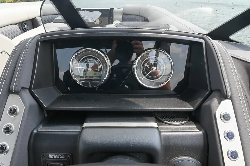 Slide: The Image of Dashboard of 2025 Barletta Lusso 25UCA boat with modern gauges and controls. - 25