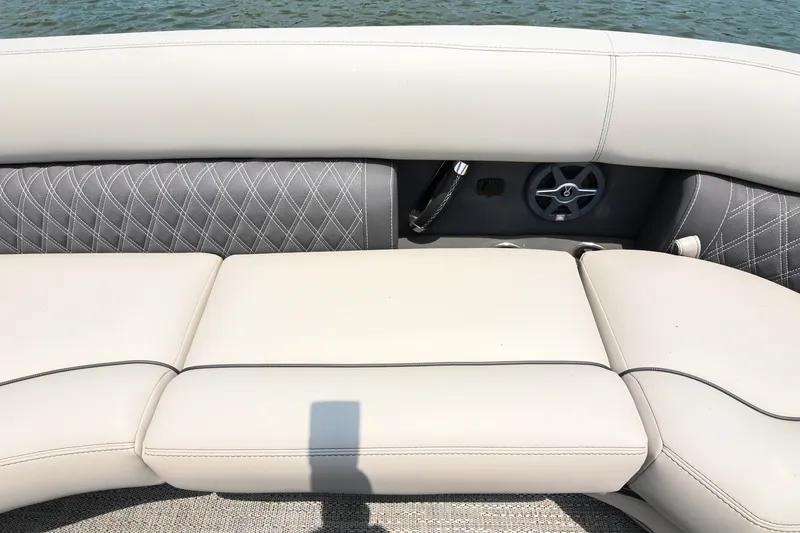 Slide: The Image of The image shows a luxurious, upholstered bench seat on a boat with quilted design. - 19