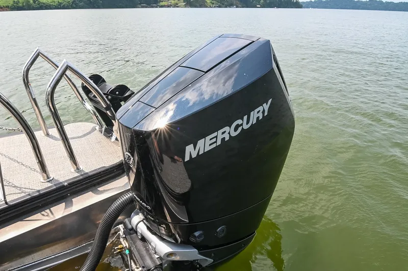 Slide: The Image of Mercury outboard motor on 2025 Barletta Lusso 25UCA pontoon boat, lake view. - 12