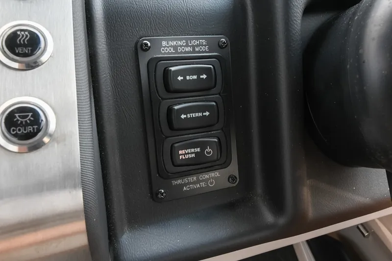 Slide: The Image of Control panel of 2025 Barletta Lusso 25UCA with buttons for bow, stern, and reverse flush. - 26