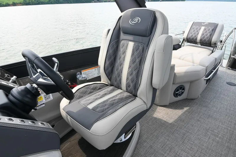Slide: The Image of Luxurious interior of 2025 Barletta Lusso 25UCA boat with plush seating and steering wheel. - 21