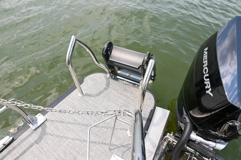 Slide: The Image of 2025 Barletta Lusso 25UCA boat with Mercury engine, rear deck view. - 13