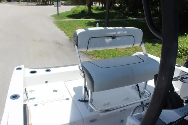 Slide: The Image of The image shows the seating area of a 2021 Yamaha 210 FSH Sport boat. - 42