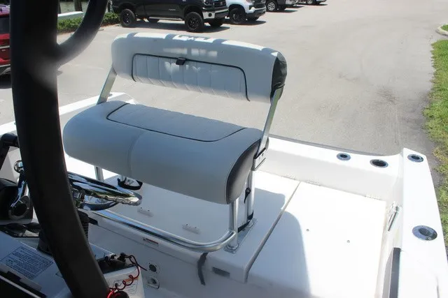 Slide: The Image of The image shows a white bench seat on a 2021 Yamaha 210 FSH Sport boat. - 41