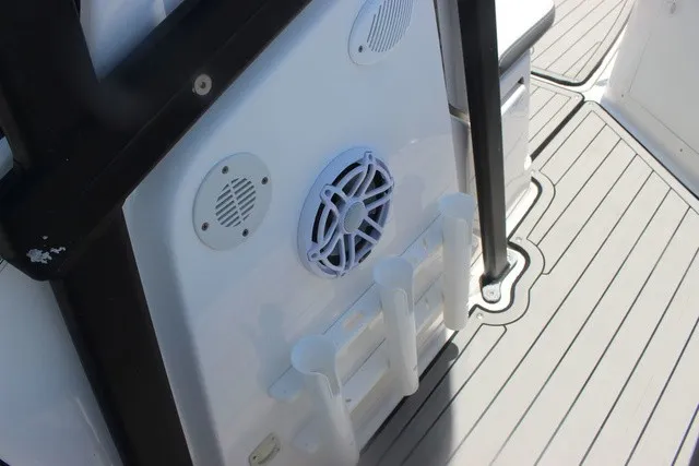 Slide: The Image of Close-up of a boat deck with speakers and mounts, likely from a Yamaha 210 FSH Sport. - 36