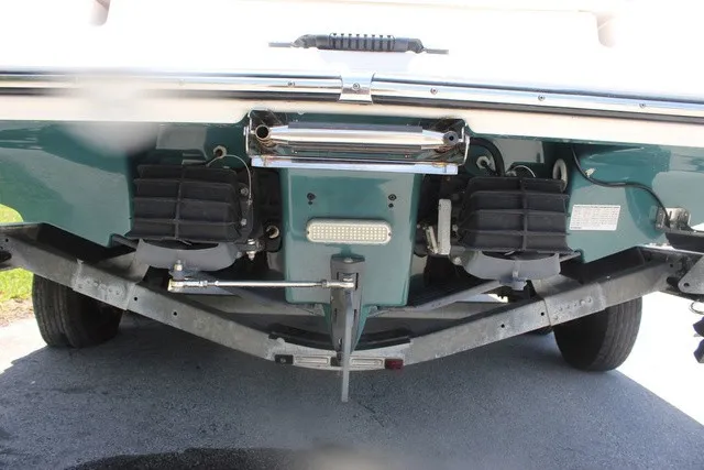 Slide: The Image of Rear view of a Yamaha 210 FSH Sport boat with dual jet drives and a trailer. - 7