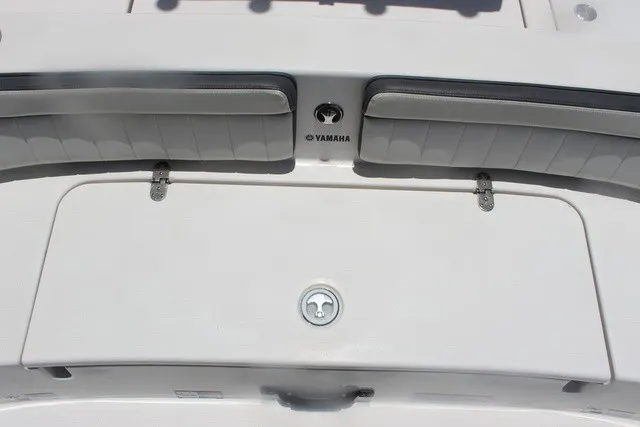 Slide: The Image of The image shows the stern of a Yamaha 210 FSH Sport boat with a storage hatch. - 19