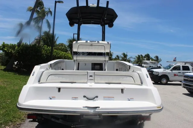 Slide: The Image of The image shows a 2021 Yamaha 210 FSH Sport boat parked on a trailer. - 6