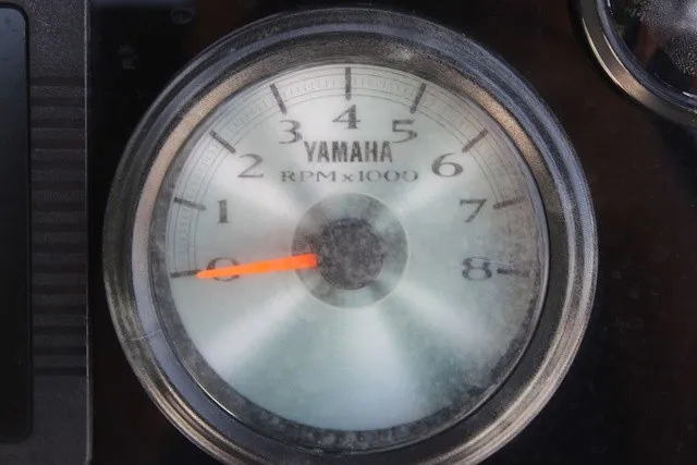Slide: The Image of Close-up of a Yamaha tachometer with a scale from 0 to 8. - 31