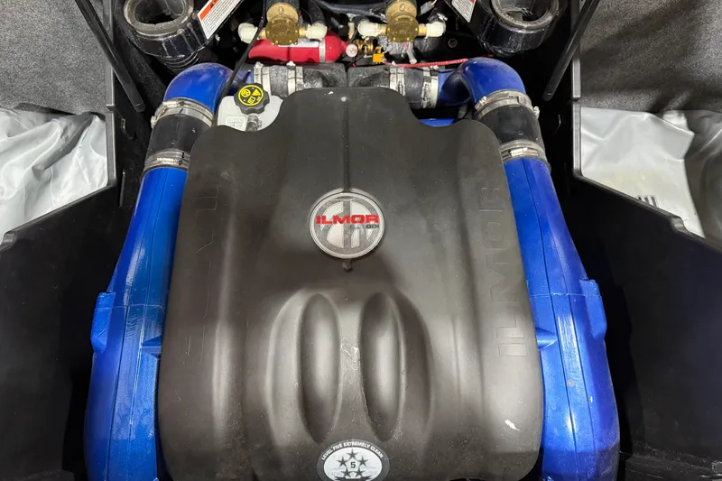 Slide: The Image of 2020 MasterCraft X22 Ilmor engine with blue hoses and detailed components. - 14