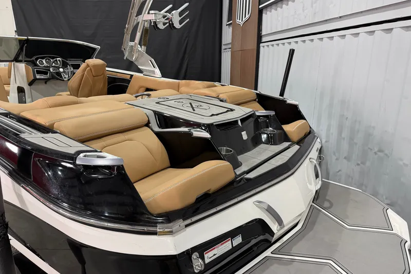 Slide: The Image of 2020 MasterCraft X22 boat interior with tan leather seating and sleek design. - 4