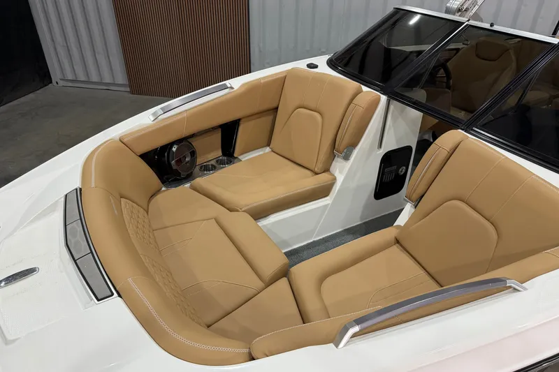 Slide: The Image of 2020 MasterCraft X22 boat interior with tan leather seating and modern design. - 3