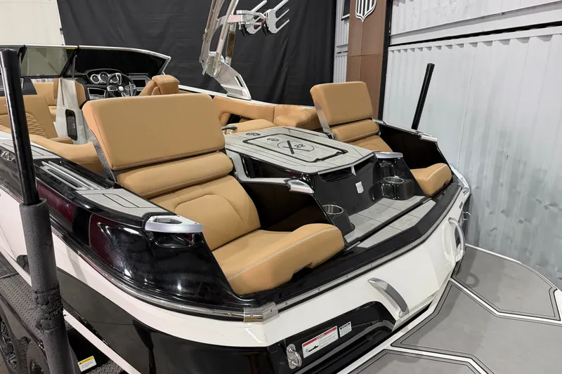 Slide: The Image of 2020 MasterCraft X22 boat interior with tan seating and sleek design. - 5