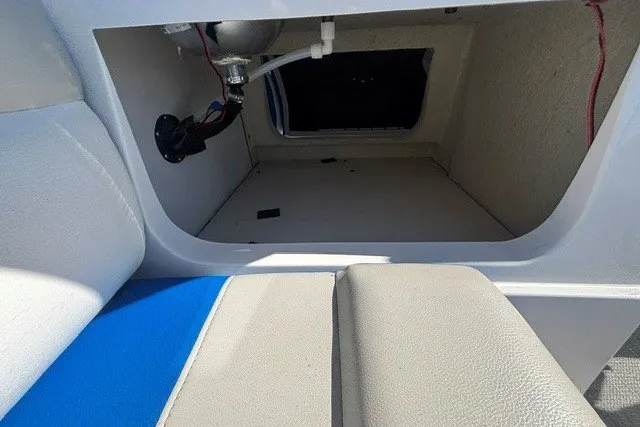 Slide: The Image of Storage compartment in a 2017 Starcraft SCX Surf 211 IO boat interior. - 23