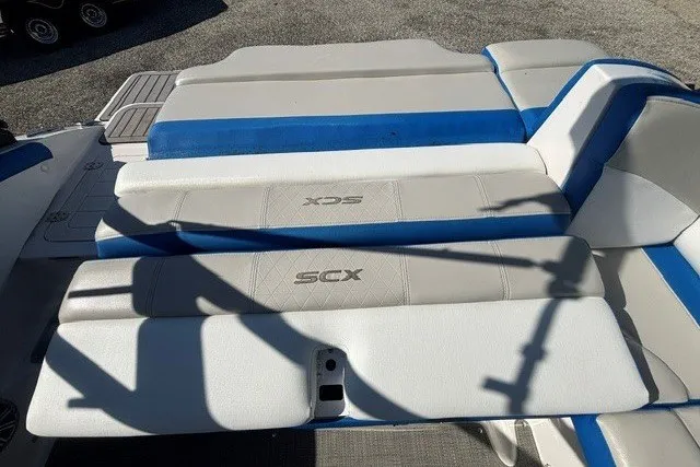 Slide: The Image of 2017 Starcraft SCX Surf 211 IO boat seating with blue and white upholstery. - 24