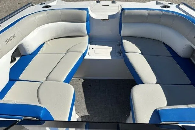 Slide: The Image of 2017 Starcraft SCX Surf 211 IO boat interior with blue and gray seating. - 7