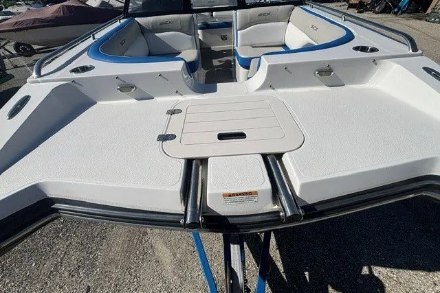 Slide: The Image of 2017 Starcraft SCX Surf 211 IO boat with spacious seating and sleek design. - 18