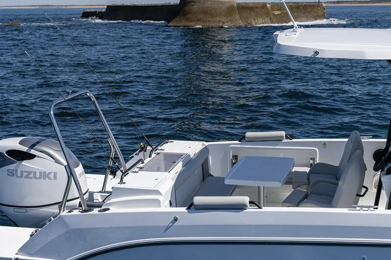 Slide: The Image of Manufacturer Provided Image: 2026 Beneteau Flyer 8 SPACEdeck boat with Suzuki engine on open water. - 4