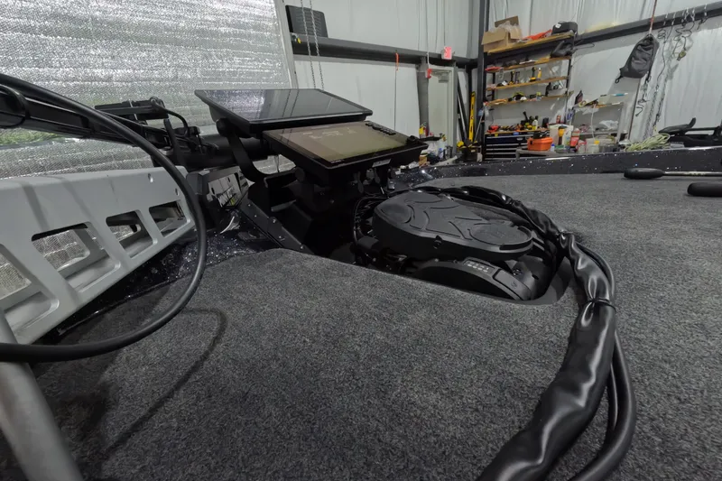 Slide: The Image of Interior view of 2026 Skeeter ZXR21 SE boat with advanced control panel. - 11