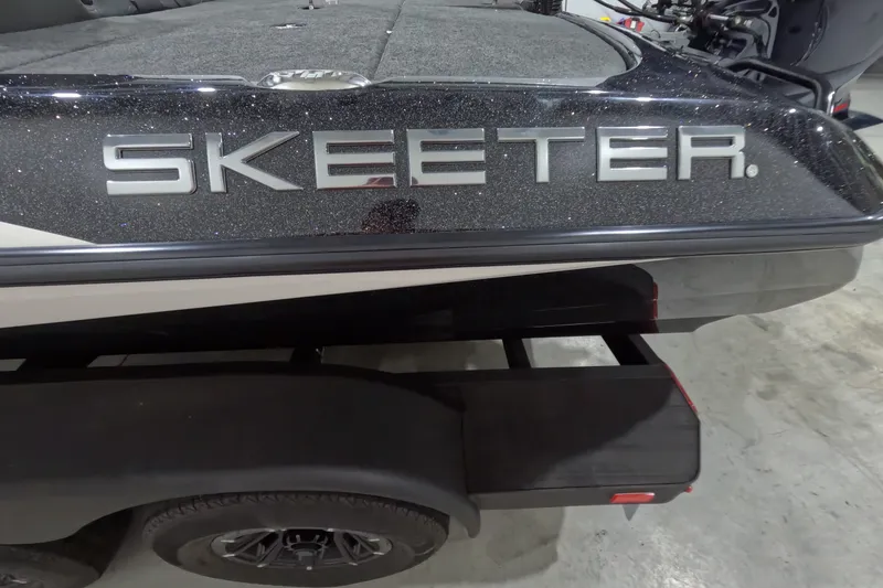 Slide: The Image of 2026 Skeeter ZXR21 SE boat with sleek black finish on trailer. - 15