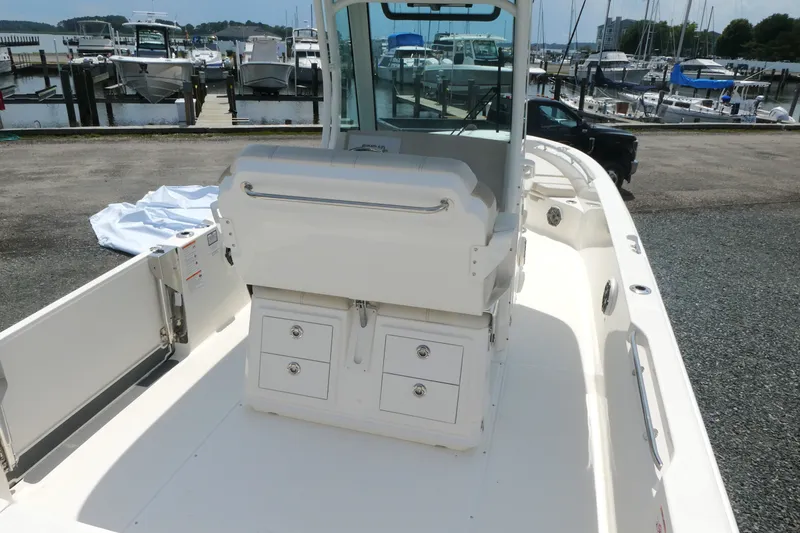 Slide: The Image of Boston Whaler 280 Dauntless 2027 boat interior with storage, docked at marina. - 7
