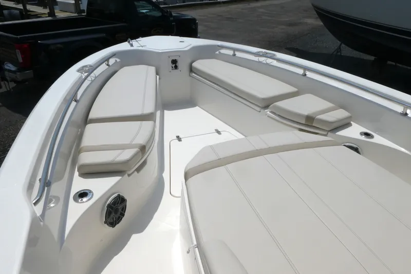 Slide: The Image of 2027 Boston Whaler 280 Dauntless boat interior with cushioned seating and sleek design. - 10