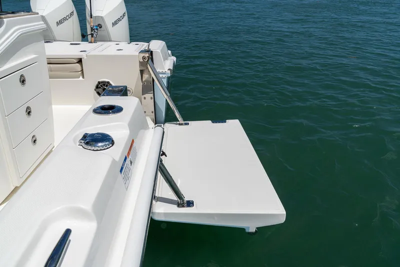 Slide: The Image of Manufacturer Provided Image: Boston Whaler 280 Dauntless 2026 boat with swim platform on calm water. - 18