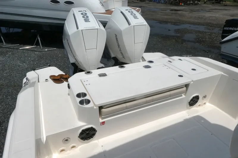 Slide: The Image of 2027 Boston Whaler 280 Dauntless boat with dual outboard engines, featuring a spacious deck area. - 5