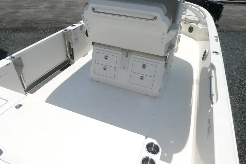 Slide: The Image of 2027 Boston Whaler 280 Dauntless boat interior with storage compartments and seating. - 3