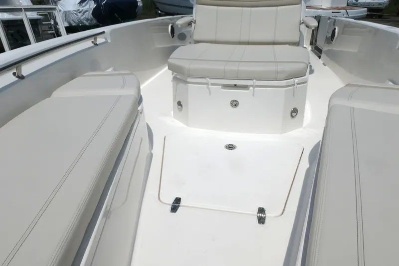 Slide: The Image of Interior view of 2027 Boston Whaler 280 Dauntless boat with cushioned seating. - 12