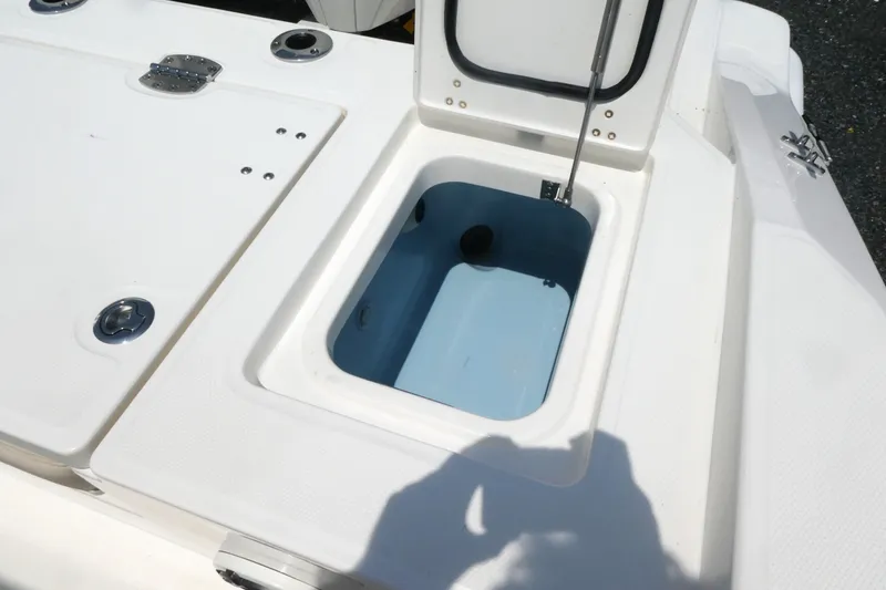 Slide: The Image of Open storage compartment on 2027 Boston Whaler 280 Dauntless boat deck. - 16