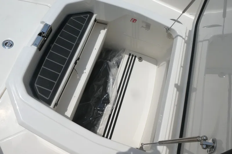 Slide: The Image of Storage compartment on a 2027 Boston Whaler 280 Dauntless boat, featuring sleek design. - 14