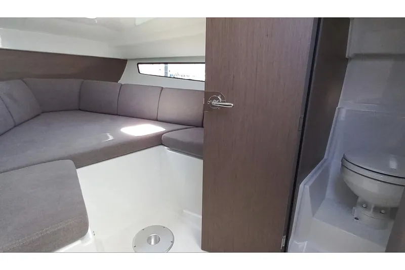 Slide: The Image of Manufacturer Provided Image: Interior of 2026 Beneteau Flyer 8 SUNdeck with seating and compact bathroom. - 4