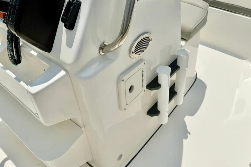 Slide: The Image of Close-up of 2025 Key West 188 Bay Reef boat console with rod holders and speaker. - 18
