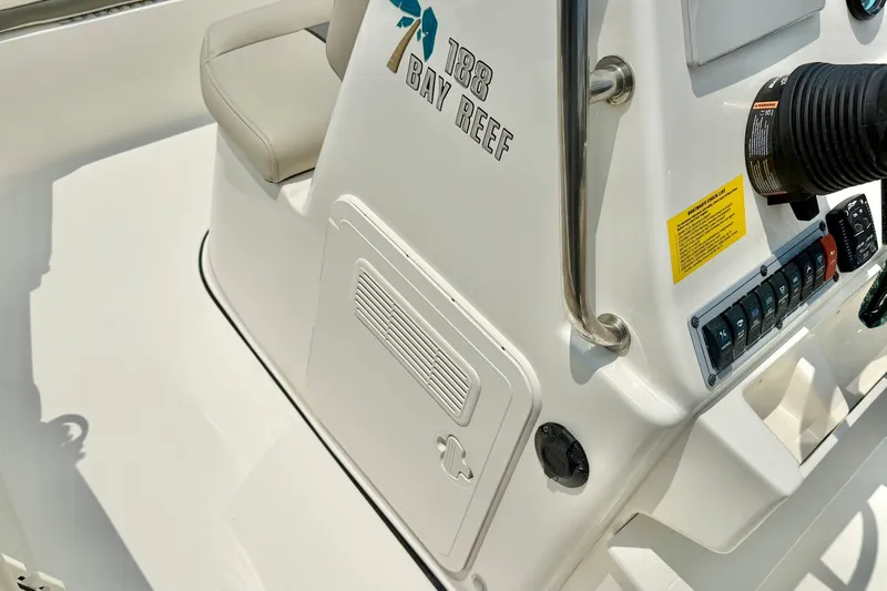 Slide: The Image of 2025 Key West 188 Bay Reef boat console with controls and seating. - 19
