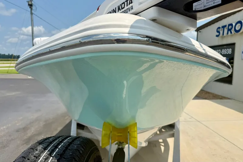 Slide: The Image of 2025 Key West 188 Bay Reef boat on trailer, close-up view of hull. - 8