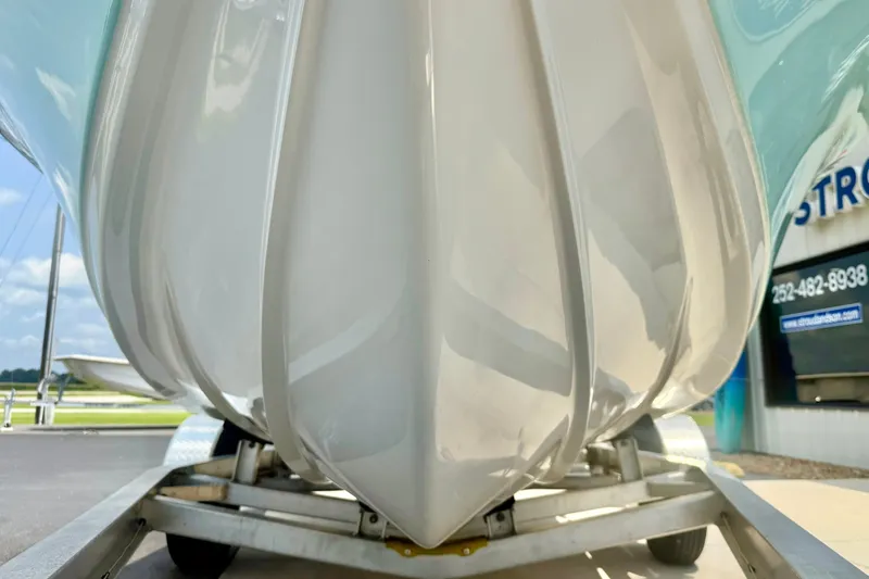 Slide: The Image of 2025 Key West 188 Bay Reef boat hull on trailer, showcasing sleek design and craftsmanship. - 9
