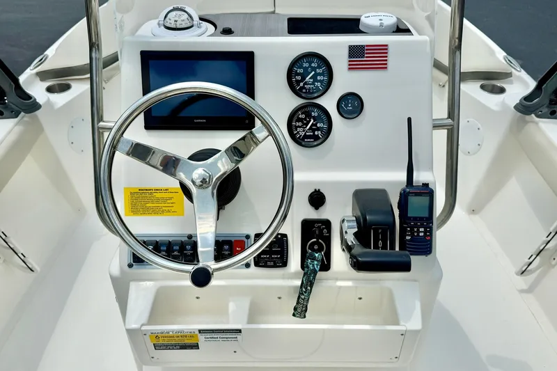 Slide: The Image of Steering console of 2025 Key West 188 Bay Reef boat with gauges and controls. - 3