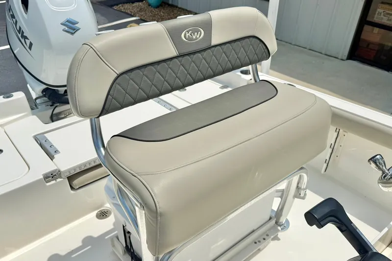Slide: The Image of 2025 Key West 188 Bay Reef boat seat with Suzuki engine in background. - 21