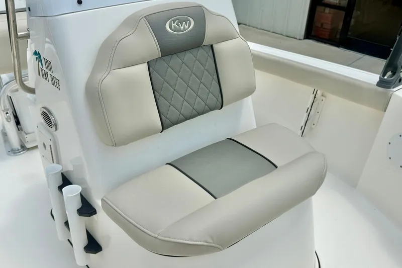 Slide: The Image of 2025 Key West 188 Bay Reef boat seat with gray and beige upholstery. - 16